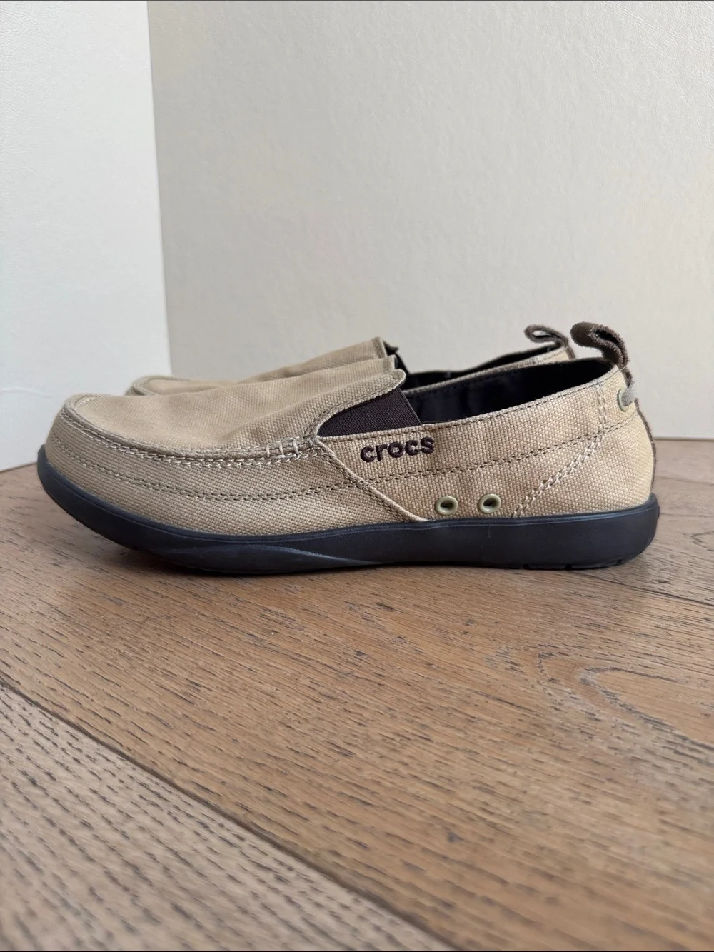 pair of khaki canvas Crocs Men's Walu Slip-On Loafers